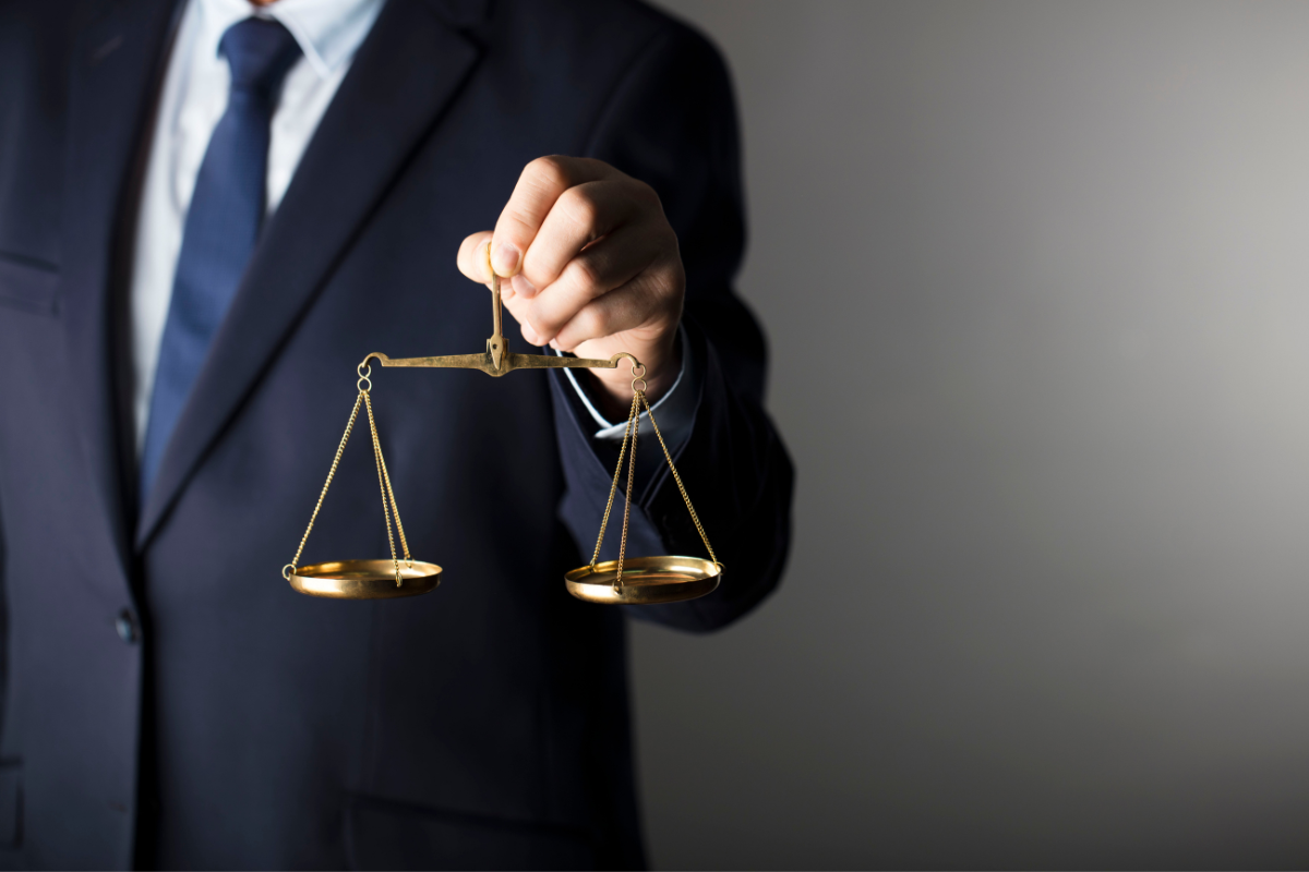 A Boulder hit-and-run lawyer holding a scale